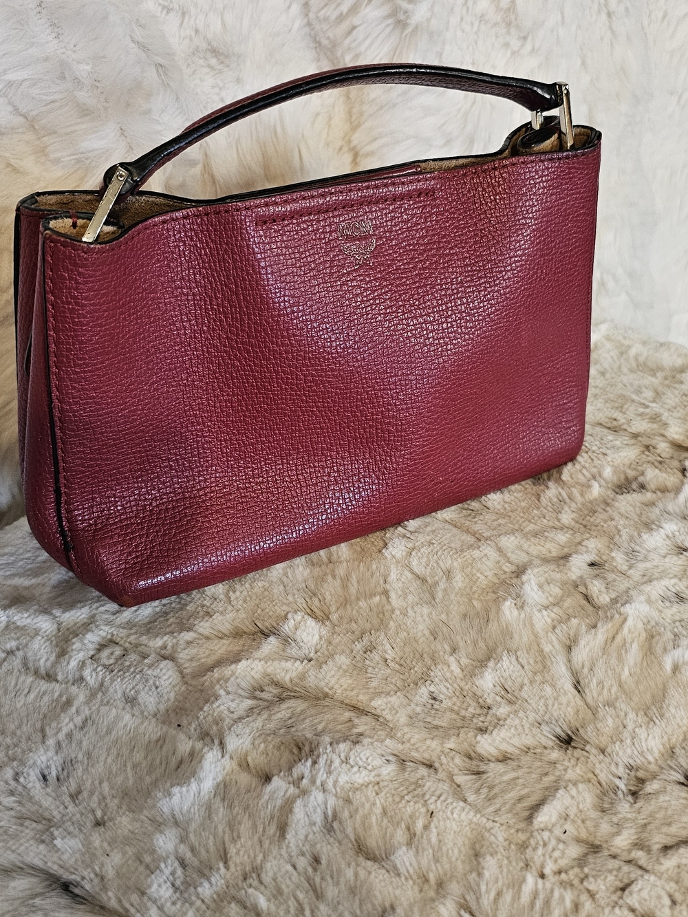 MCM Burgundy Pebbled Leather Top-Handle Clutch Styled With Unbranded Chain.